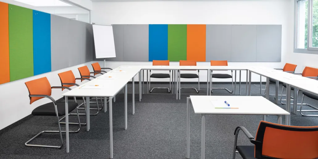 Training room at the Vienna training center with U-shaped seating and a flip chart